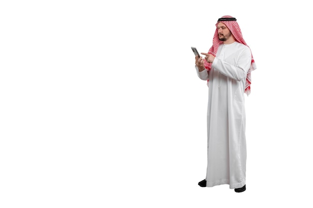 Male Arab with phone in hand isolated white background in traditional costume Ready for cutting and editing