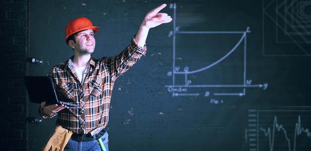 Photo male architect builder in a protective helmet and with papers in hands