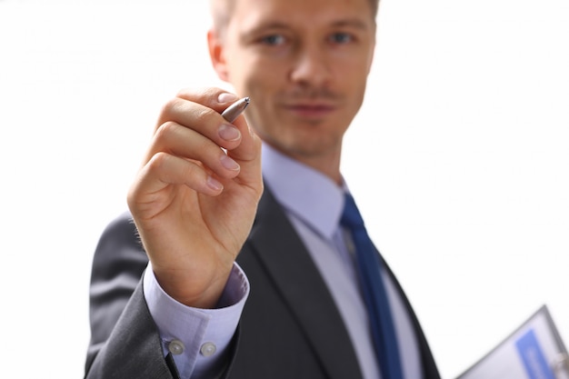 Male arm in suit and tie fill form clipped to pad