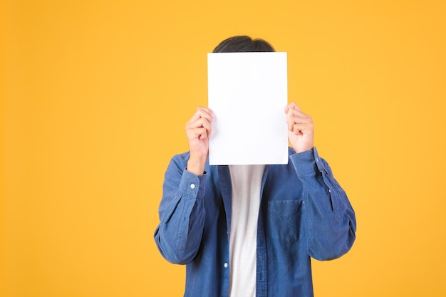 Male asian hand is holding blank paper board on white background