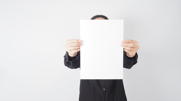Photo male asian hold blank paper and wear black shirt on white background.