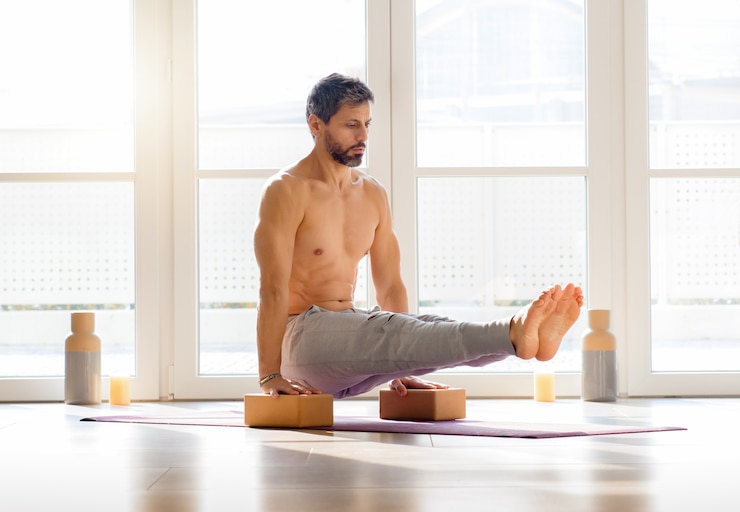 Photo male athlete doing l sit exercise on bricks