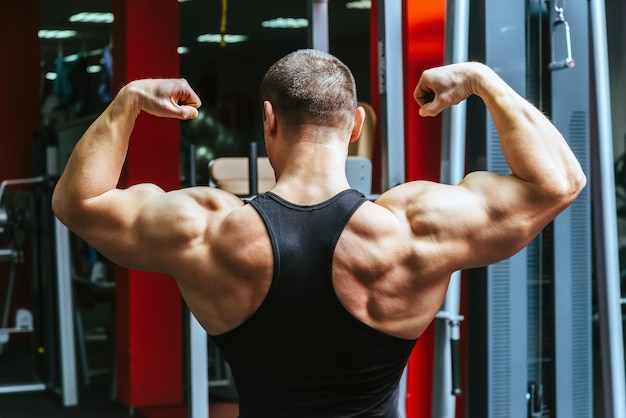 Male athlete posing in the gym