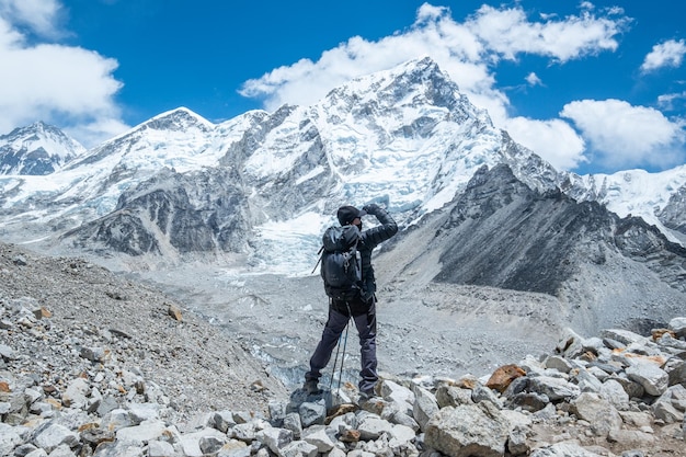 Male backpacker enjoying the view on mountain walk in himalayas\
everest base camp trail route nepal trekking himalaya tourism