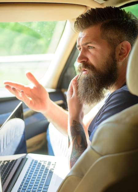 Male barber care Bearded man Mature hipster with beard Taxi traffic jam on road time gas station brutal caucasian hipster with moustache conversation