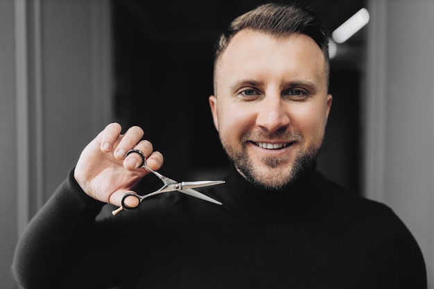 Male in barbershop haircut shaving Bearded man Mans haircut in barber shop