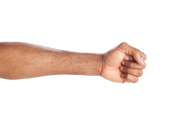 Male black fist isolated on white background. African american clenched hand, gesturing up. Counting, aggression, brave, masculinity concept