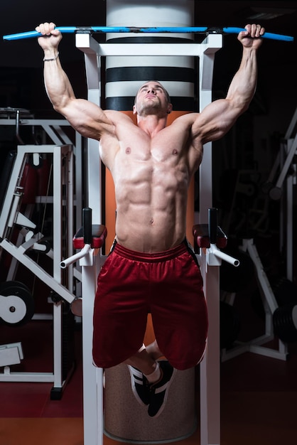 Male Bodybuilder Doing Heavy Weight Exercise For Back