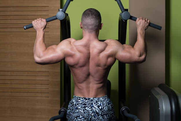 Male Bodybuilding Athlete Doing Pull Ups