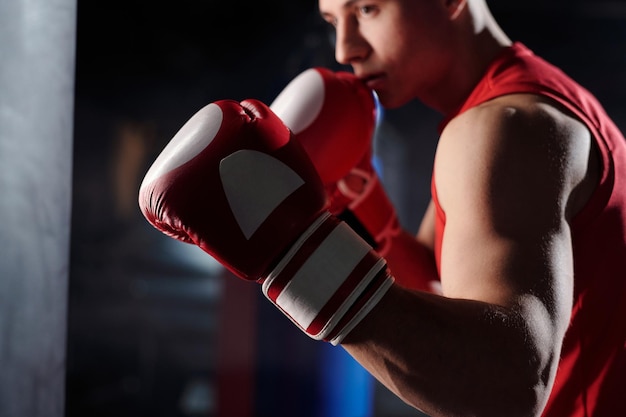 Male boxer in front of punching bag