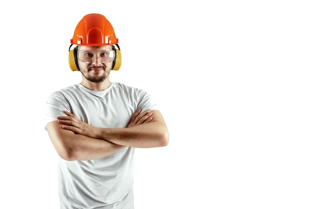 Male builder in orange helmet isolated on white background