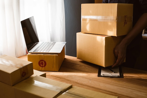 male business owner working packing the order for shipping to customer