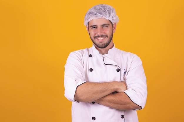 Male chef on background with cross arms