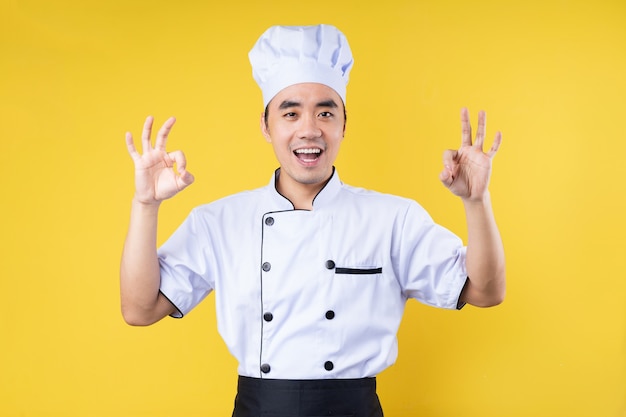 Male chef portrait, isolated on yellow background