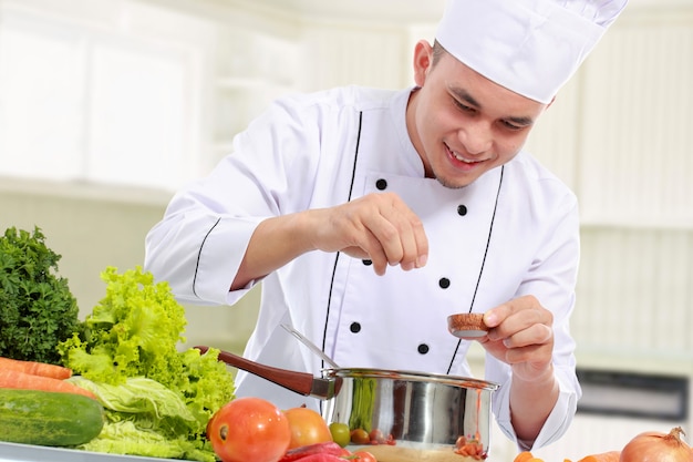 Male chef while cooking