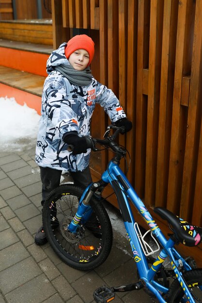 Male child sitting and resting between cycling