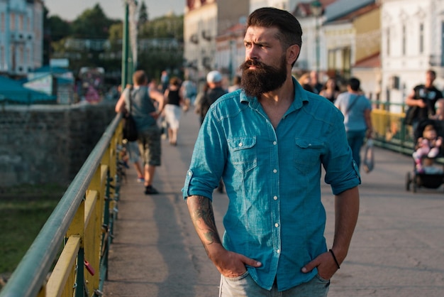 Male city portrait hipster outdoors walking on town streets