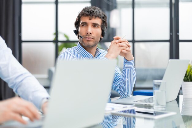 Male colleagues working in a call center