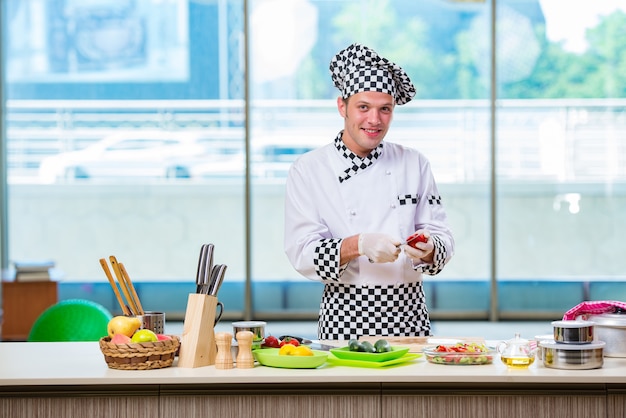 Male cook preparing food in the kitchen