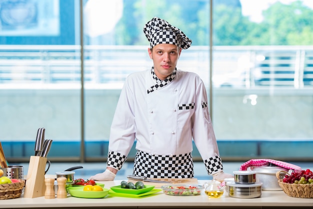 Male cook preparing food in the kitchen