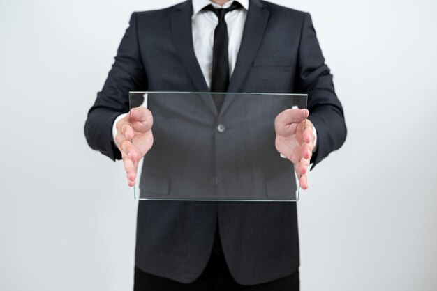 Male Corporate Holding Transparent Glass And Displaying Important Announcement Businessman Wearing Suit Showing Rectangular Board And Promoting Company Brand