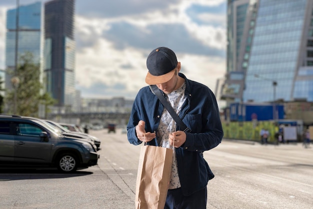 A male courier carrying the backpack with delivery