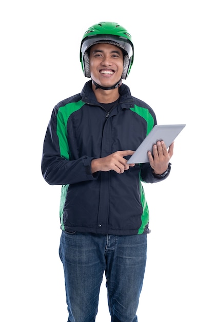 Male courier driver holding tablet pc isolated over white background