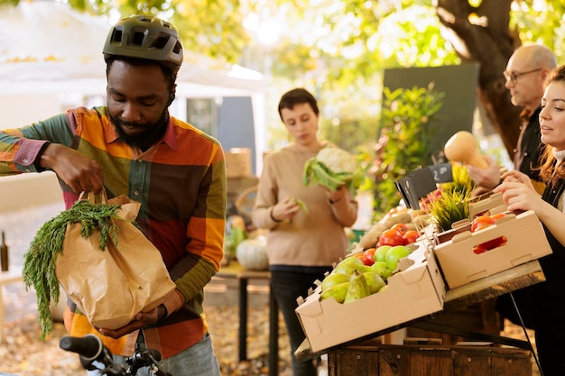 Male courier picks up order from farmers