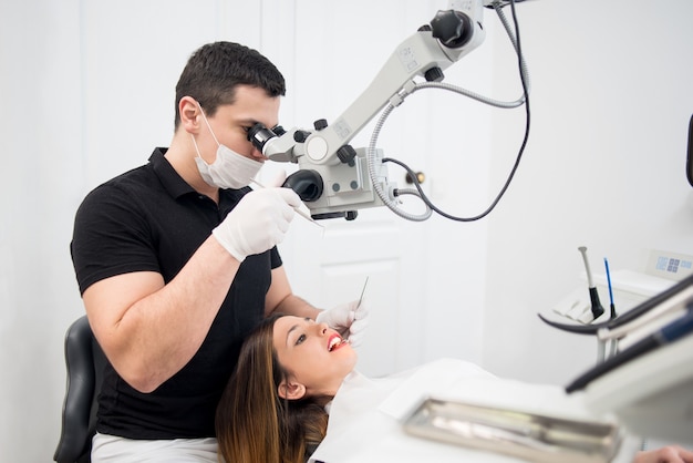 Male dentist treating a patient