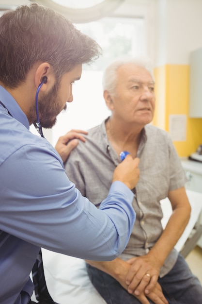 male doctor examining a patient
