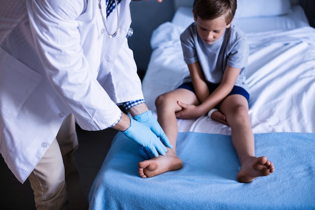 Male doctor examining patient