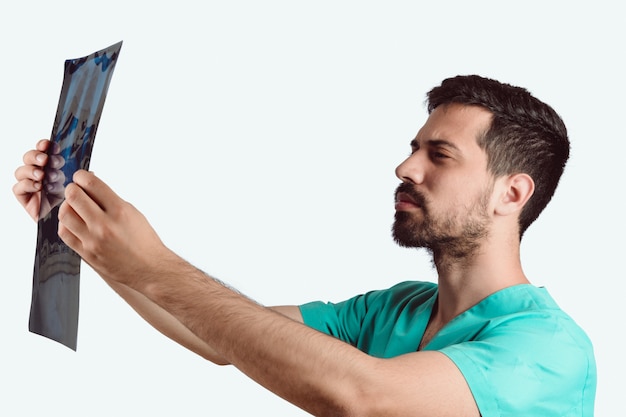 Male doctor examining xray.