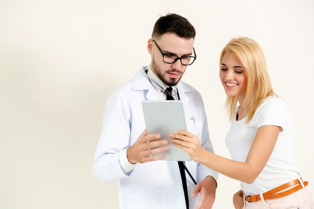 Male Doctor and Female Patient in Hospital.