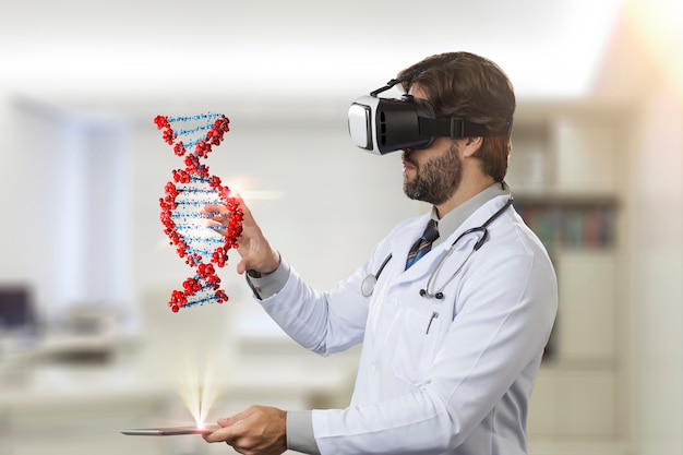 Male doctor in his office, looking at a virtual DNA coming out of a tablet