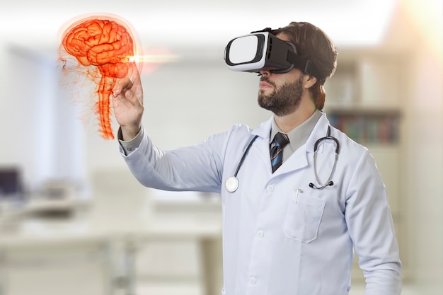 Male doctor in his office, using a Virtual Reality Glasses, looking at a virtual brain