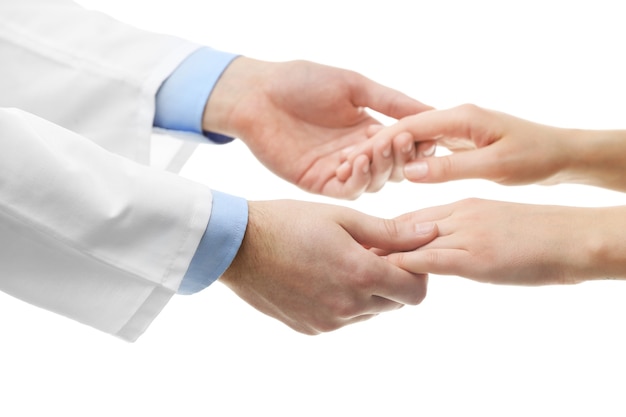 Male doctor holding patient's hand