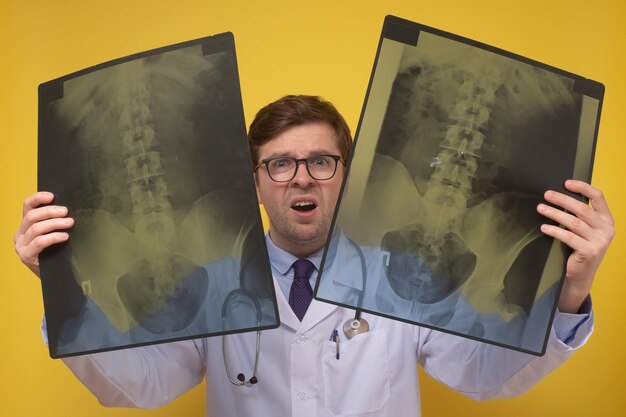 Photo male doctor holding xray or roentgen image being confused with results