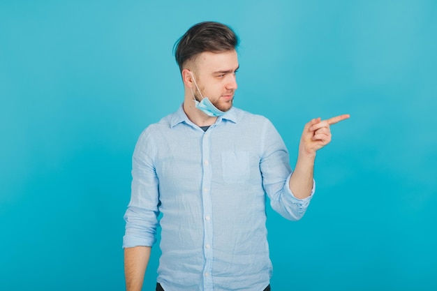 male doctor in medical mask on blue background