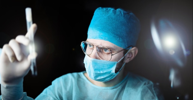 male doctor scientist working in the laboratory at night