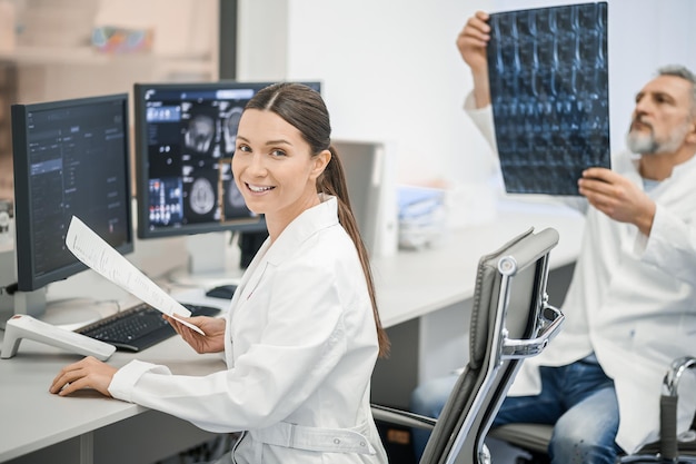 Male doctor scrutinizing the MRI results