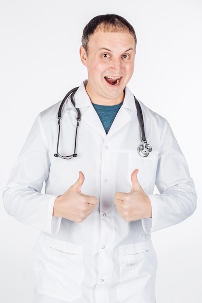 Male doctor show thumb up to you on white background