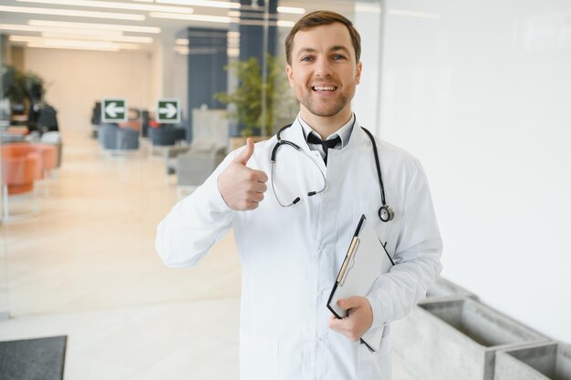 Male Doctor stands in the hall of the hospital