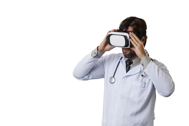 Male doctor using a Virtual Reality Glasses on a White wall