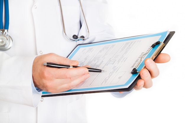 Male doctor with a patient history folder, isolated on white