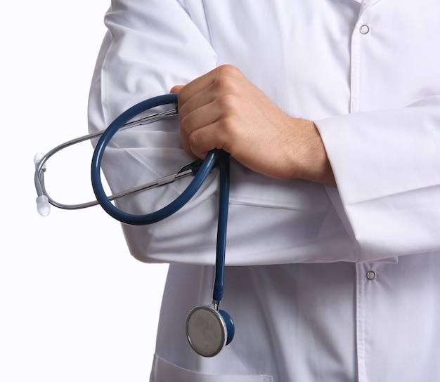 Male doctor with stethoscope isolated on white