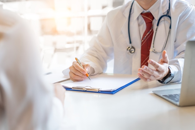 Male doctor and woman patient.