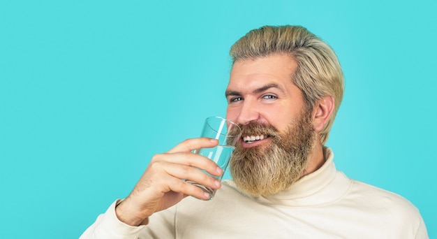 Male drinking from a glass of water