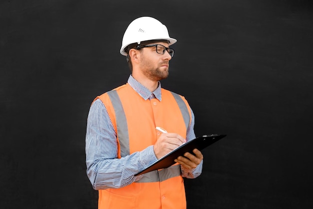 Male engineer hard hats west confident build worker blank black\
background build service copy space