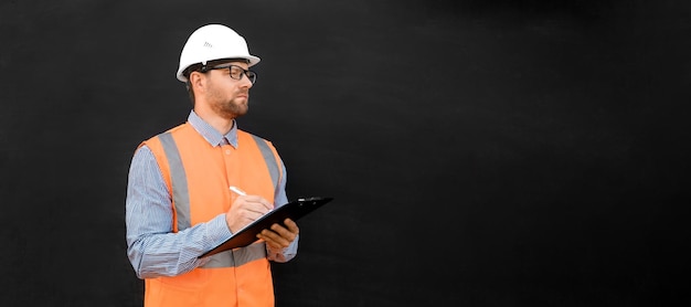 Male engineer hard hats west confident build worker blank black\
background build service copy space