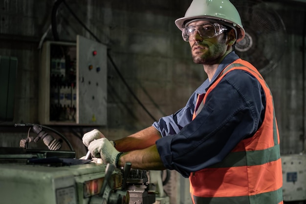 Photo male engineer working in an industrial factory concept industry